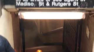Black suitcase on fire bottom of subway stairs