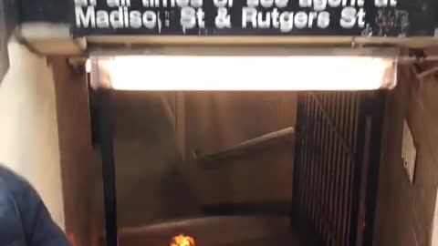 Black suitcase on fire bottom of subway stairs