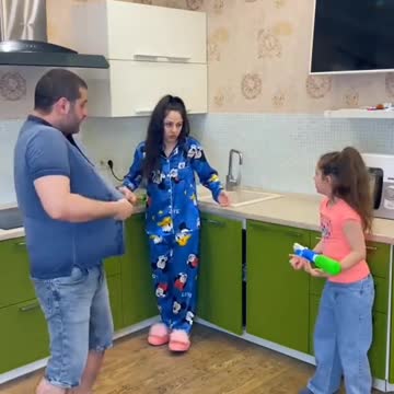 husband throws water at his wife lots of laughs