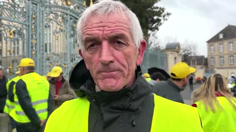 French farmers block roads, dump produce near Paris