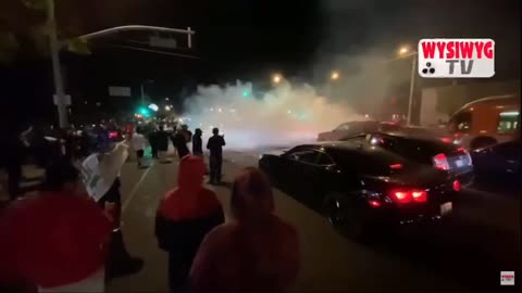 Dodgers fans watching burnouts on the road in California.