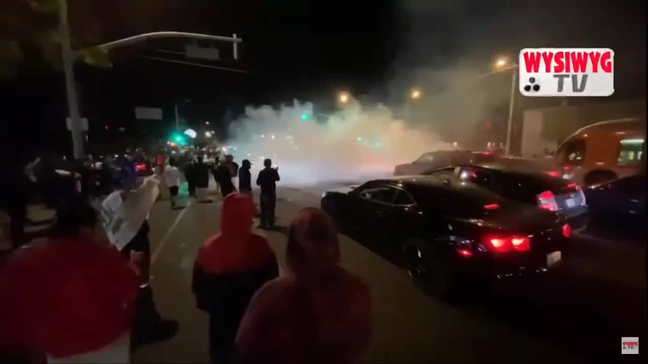 Dodgers fans watching burnouts on the road in California.