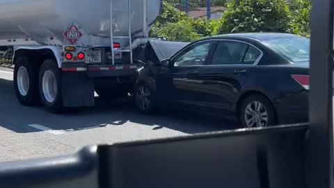 Tanker Drags Car Along Interstate