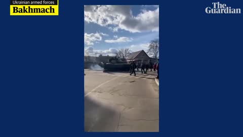 Ukrainian resistance_ man tries to push back Russian tank