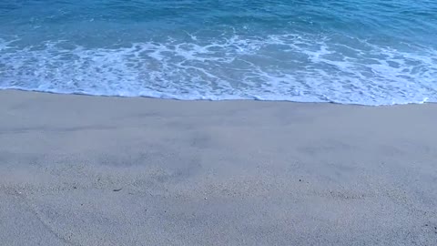 Clam and peaceful blue beach