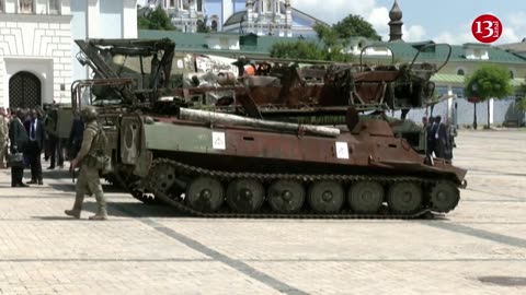 African delegation touring wreckage of Russian vehicles in central Kyiv during peace mission