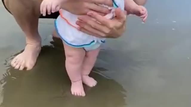 Cute Baby on Beach laughing..