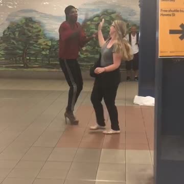 Guy red shirt black hat dancing with grey shirt girl subway