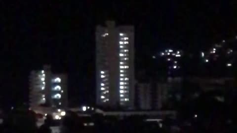 Bright Falling Light Across Acapulco Sky