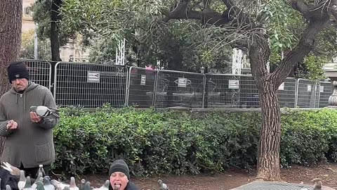Woman Feeds Pigeons From Her Mouth