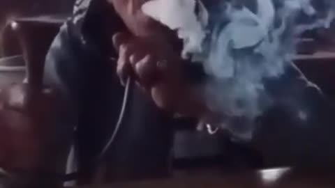 Old Man taking HUKKA