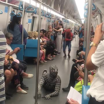 Red spiderman and black and white spiderman dancing