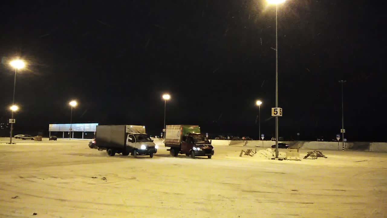 Trucks Drift For Fun in Snowy Lot