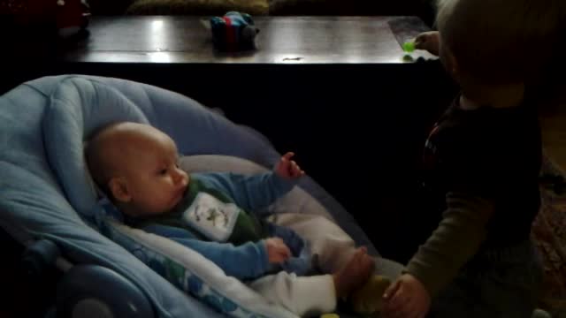 Toddler Bodhi sooths his new baby brother