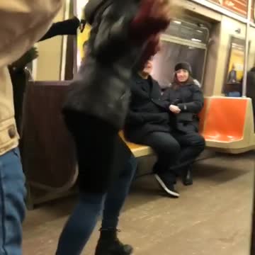 Lady in subway films herself dancing for a music video without music playing