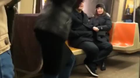 Lady in subway films herself dancing for a music video without music playing