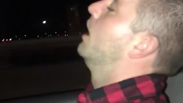 Guy red checkered shirt sleeping in uber