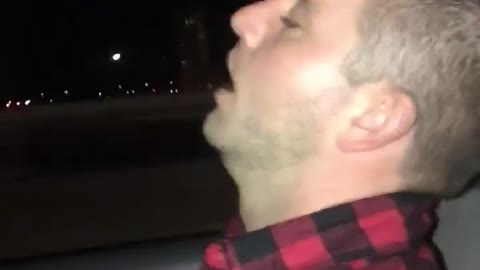 Guy red checkered shirt sleeping in uber
