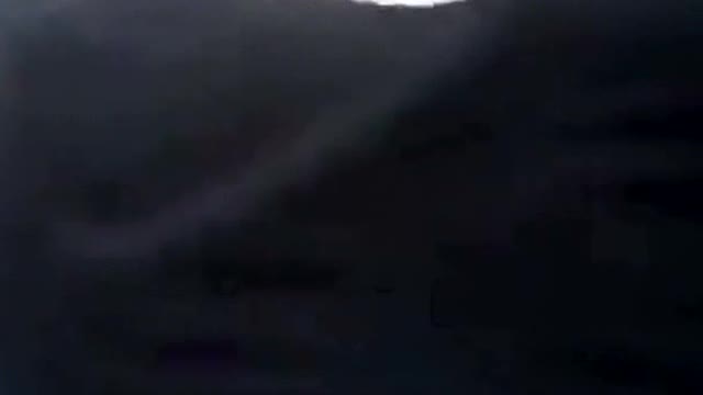 A thief steals a TV reporter's phone during live coverage on the road