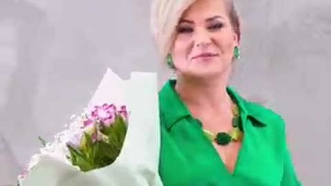 Hair dye and glitter makeup transform woman's appearance.