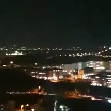 Sounds of gunfire, explosions near Iran's capital
