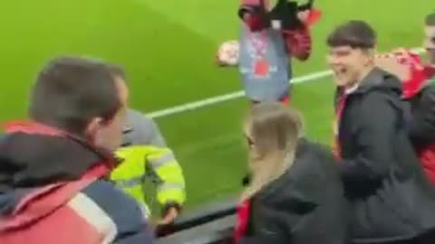 Fans formed a security ring for the boy who managed to get the football ball