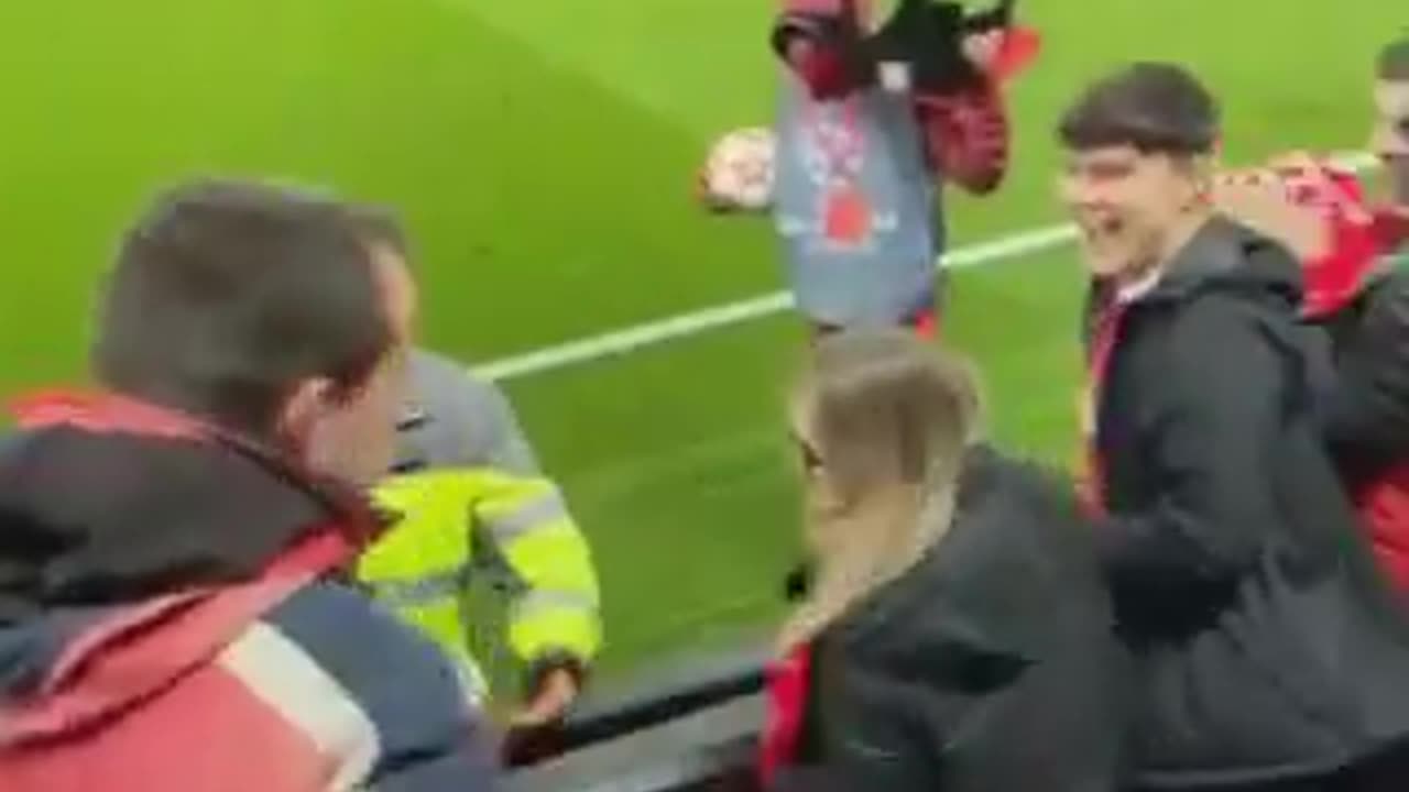 Fans formed a security ring for the boy who managed to get the football ball