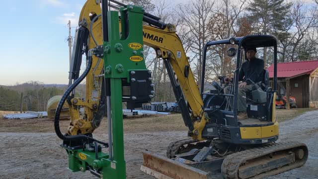 Rambo post driver on mini excavator