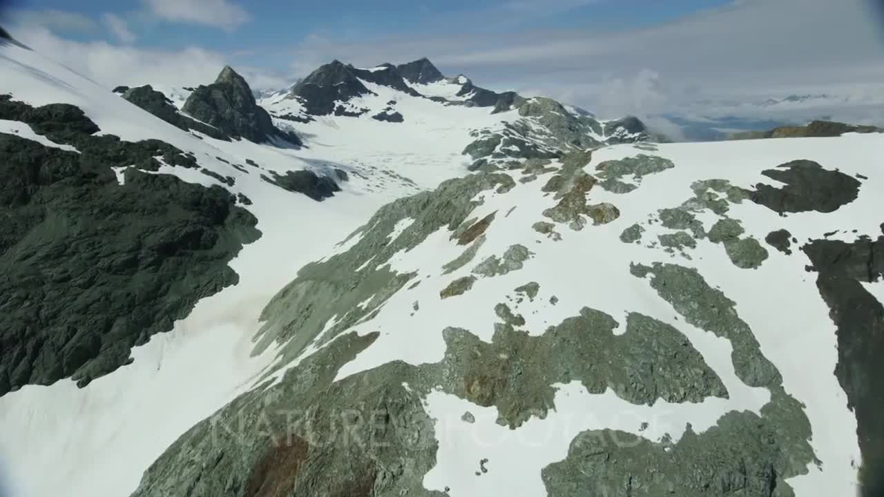 Scenic aerial of snow-capped mountains in Glacier Bay National Park and Preserve