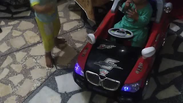 Two brothers enjoying with new car