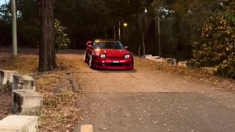 A red car at sunset