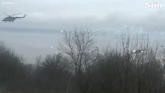 As Putin starts an invasion, a swarm of Russian helicopter gunships flies over Ukraine's airport.