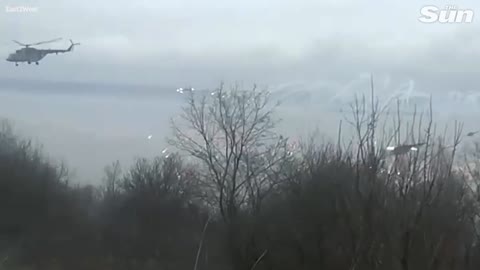 As Putin starts an invasion, a swarm of Russian helicopter gunships flies over Ukraine's airport.