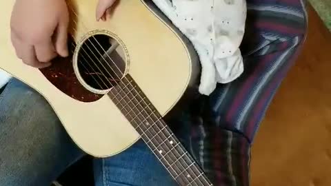 baby and daddy's guitar