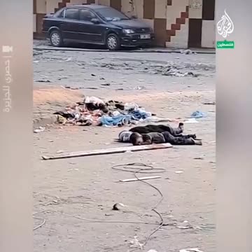 Palestinians desperately try to rescue a child whose mother lies murdered, by an Israeli sniper.