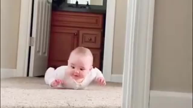 Funny baby playing peek-a-boo