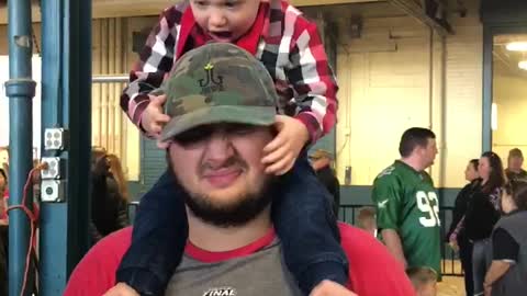 Teething toddler bites his Daddy