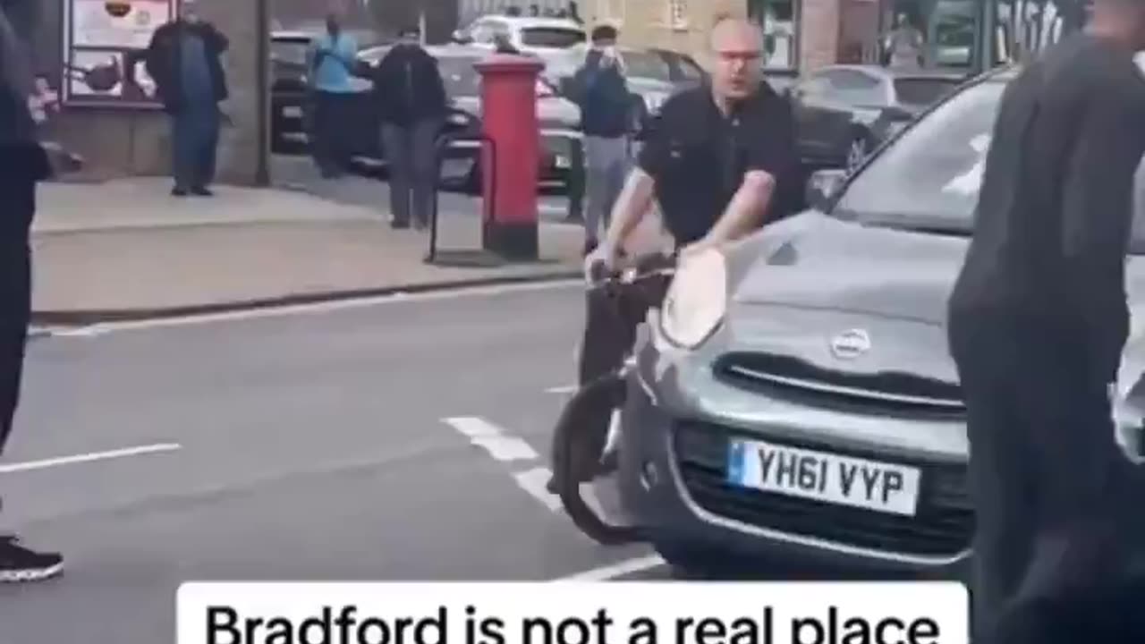 Uk police officer on bike circling car