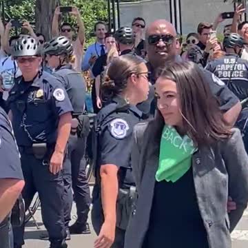 AOC Pretends To Be Handcuffed In PATHETIC Video