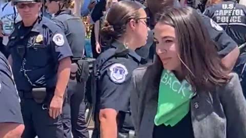 AOC Pretends To Be Handcuffed In PATHETIC Video