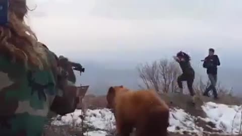 A bear attacking two cameramen!