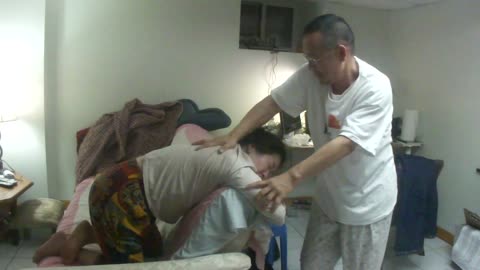 Luodong Massages Wife While She Bends Over Couch