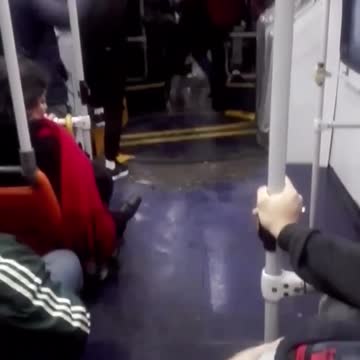 Subway train flooding people hanging from hand bars floor