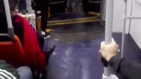 Subway train flooding people hanging from hand bars floor