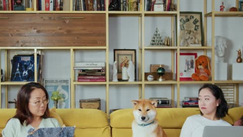 Mother and Daughter Sitting on the Couch