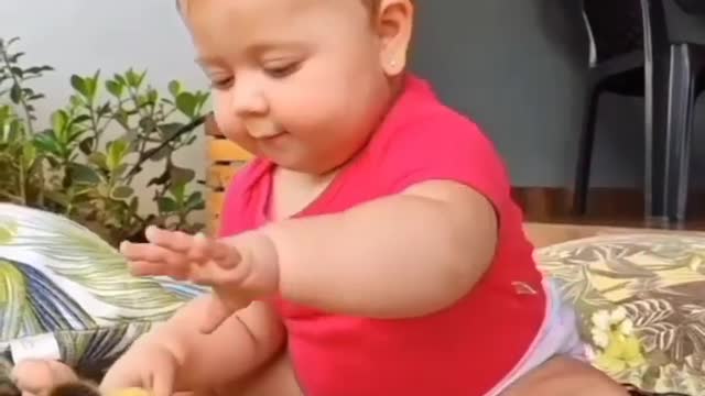 Cute Baby playing hen kitty