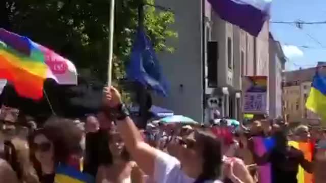 LGBT parade in support of yellow and blue flags in Munich