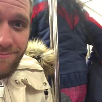 Woman wears underwear outside of her pants on a subway train