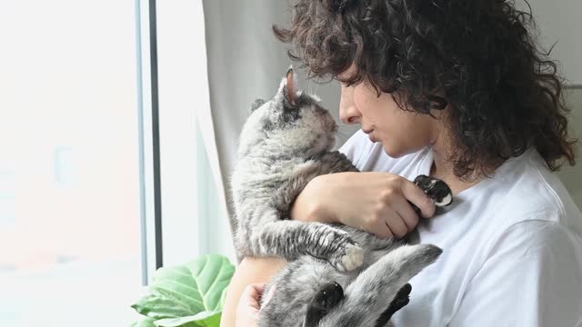 Woman Cuddling Her Cat