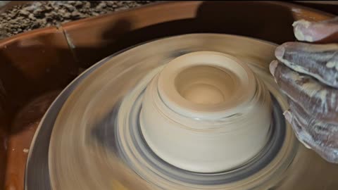Pottery:centering and opening.